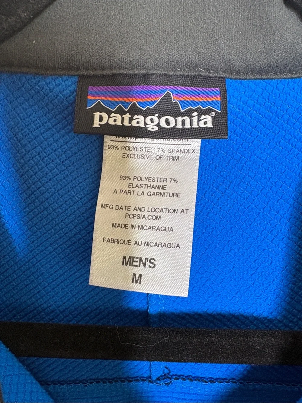 Patagonia Navy Blue Softshell Vest with Orange Accents